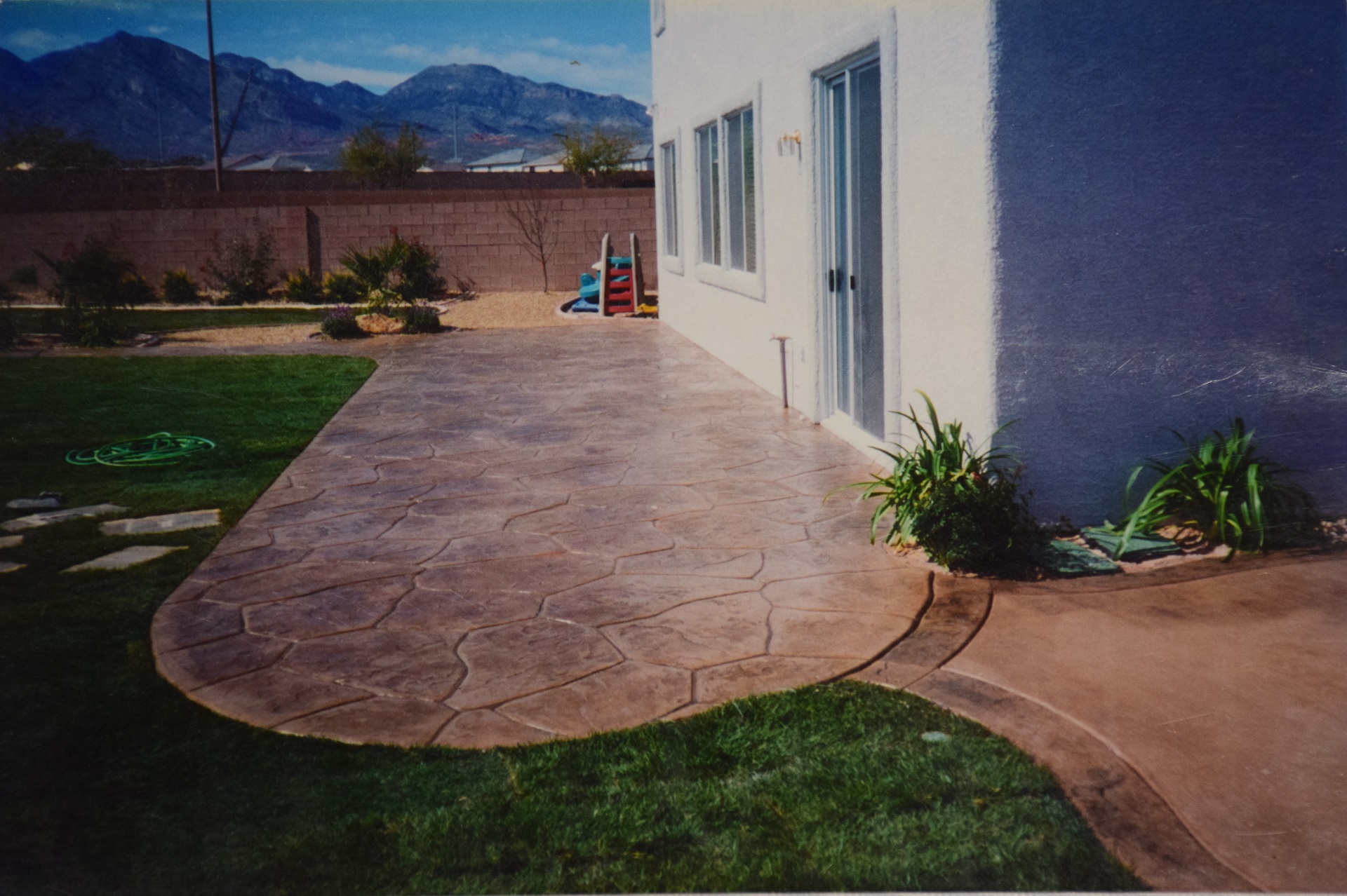 Backyard stamped concrete patio