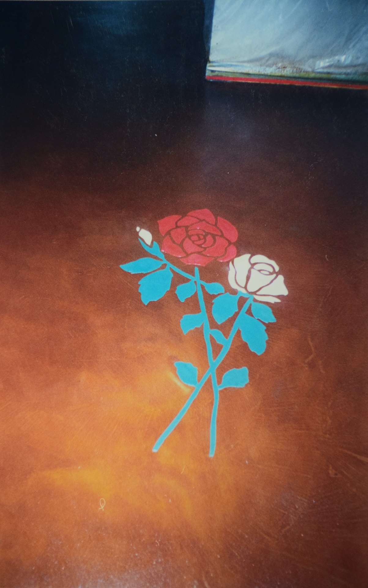 Decorative concrete floor with inlaid rose bouquet design