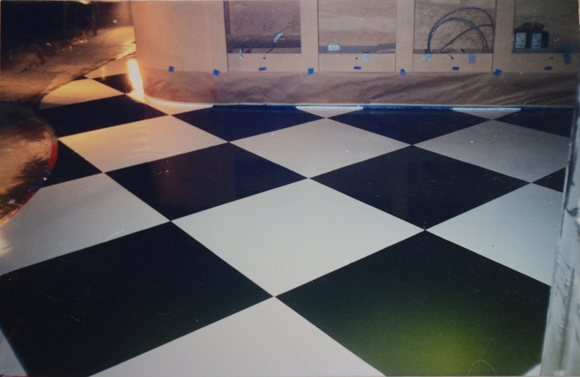 Completed bold black and white checker pattern concrete floor