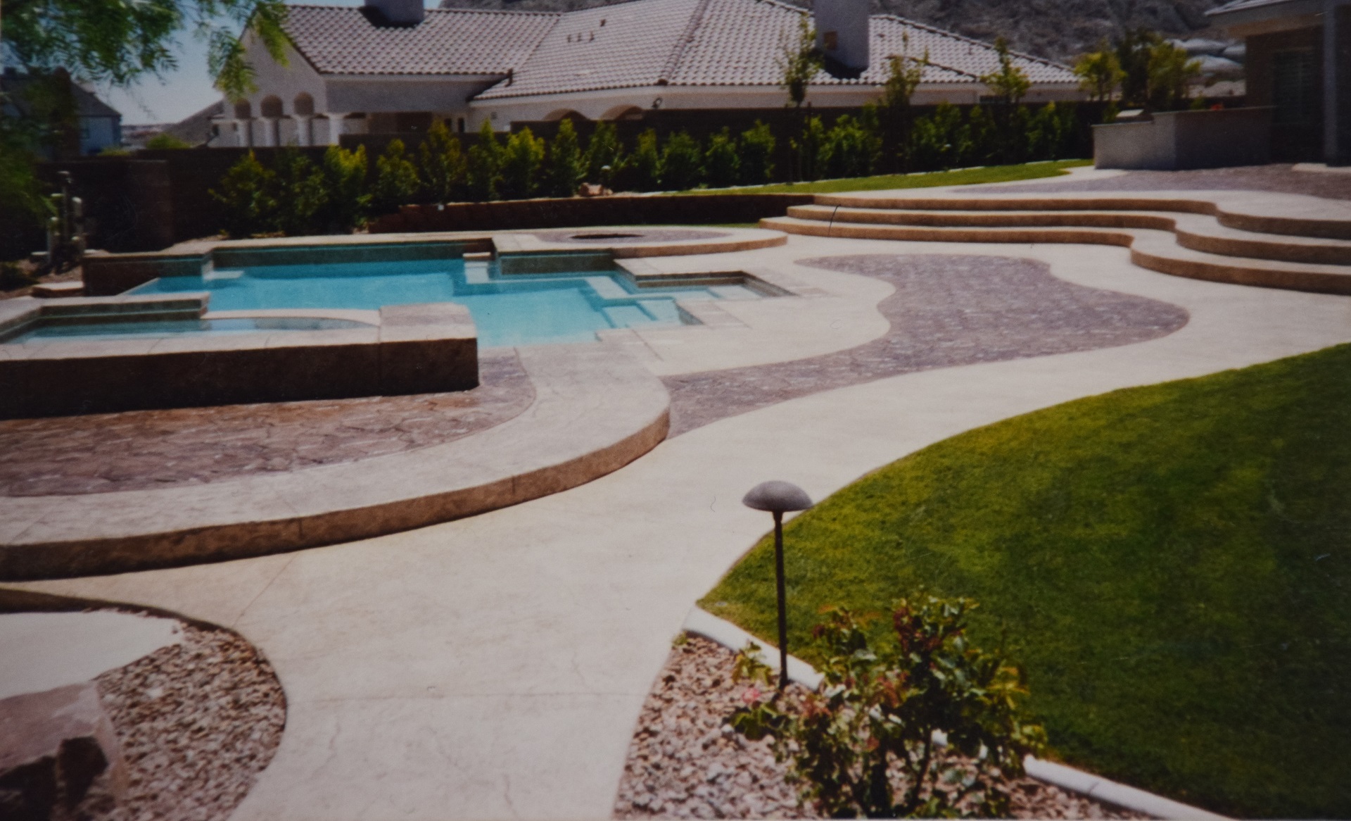 Beautiful pool deck with decorative concrete